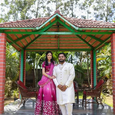 A picture-perfect couple at their engagement. For the bride, I created a lovely pink eyeshadow look to complement her vibrant lehenga, keeping the overall feel elegant and celebratory for their outdoor event.