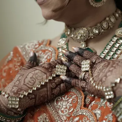 The perfect bridal stain. This is the deep, rich maroon color my organic henna achieves, beautifully complementing the bride's traditional jewelry and outfit.