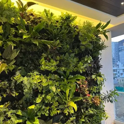 This lush, jungle-themed vertical garden brings a dramatic splash of nature indoors. We used a dense mix of ferns, pothos, and other foliage plants to create a rich, textured living wall, highlighted by warm overhead lighting.
