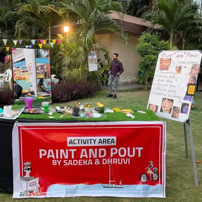 This is our professional event setup, ready to bring the fun to any location. Our activity area is clearly marked and showcases examples of our work, making it easy for guests to see what we offer.