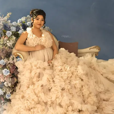 She dreamt of a fairytale moment, and we brought it to life. This couture maternity experience, with its soft florals and ethereal gown, was designed to reflect her grace and glow.