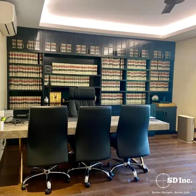 A classic lawyer's office we designed, featuring a floor-to-ceiling bookshelf for legal volumes. The large desk and ergonomic chairs create a commanding and professional workspace.