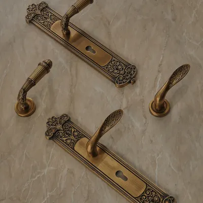 A celebration of ornamental design, our Volga Collection features door handles with intricate carvings and timeless charm. The lever handles, shown here on both a long plate and a rose, are designed to transform doors into statements of luxury.