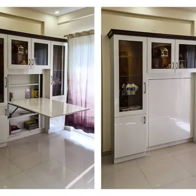 This split image demonstrates a smart, space-saving solution for a compact room. I designed this custom wall unit with integrated cabinetry and a fold-down table that serves as a study or work desk when needed and tucks away neatly when not in use.