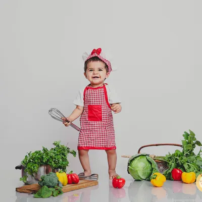 Our "Little Chef" setup is a client favorite, complete with a chef's hat, apron, and plenty of "ingredients" for a fun, interactive photoshoot. It’s a wonderful way to capture their budding curiosity.