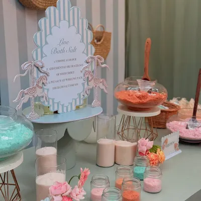 A "Live Bath Salt" station at the Parisian baby shower, where guests could create their own custom-scented bath salts as a unique and interactive party favor.