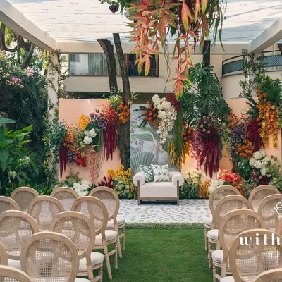 A full view of our 'Garden of Gaia' setup for a seemantha ceremony. The backyard was transformed with a stunning floral wall, creating a lush, vibrant, and celebratory space for the mom-to-be.
