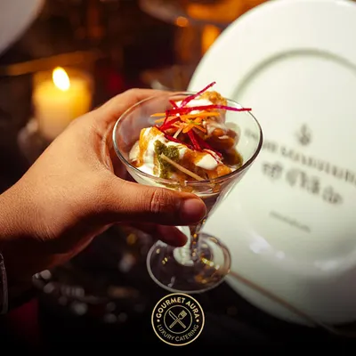An elegant presentation of chaat in a martini glass, showcasing how we elevate classic Indian street food into a gourmet experience suitable for the most luxurious events.
