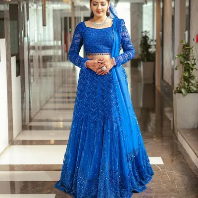 The perfect shot of a happy client in her custom royal blue lehenga. I designed this piece to be a showstopper, and her confidence and joy say it all.