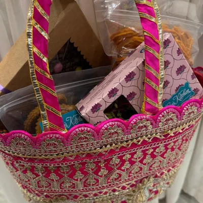 A beautiful pink embroidered basket filled with our homemade festive treats. You can curate your own hamper with your favorite snacks and sweets to gift to friends and family.