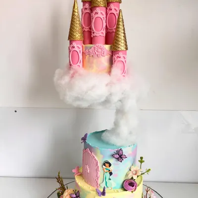 This gravity-defying princess castle cake is a fairytale brought to life. We engineered this piece with a floating top tier resting on a cloud of cotton candy, complete with intricate, hand-sculpted details and a soft pastel watercolor finish, making it a truly magical centerpiece.