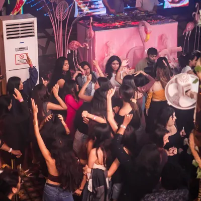 An overhead shot of the packed dance floor at Happy Brew during a 'Tease Tuesday' night. You can see me on the decks, controlling the energy and keeping the crowd moving to a mix of commercial and tech house.