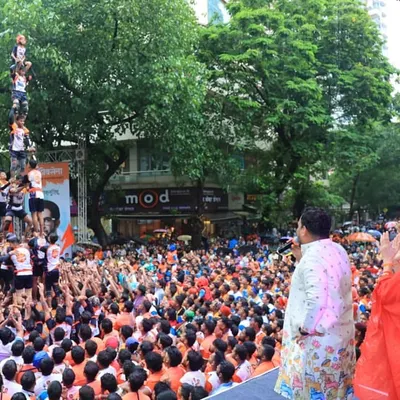 A breathtaking view from the stage as a Govinda team forms a multi-tiered human pyramid. We ensure our stage and viewing areas are designed to capture the full spectacle of such traditional feats.