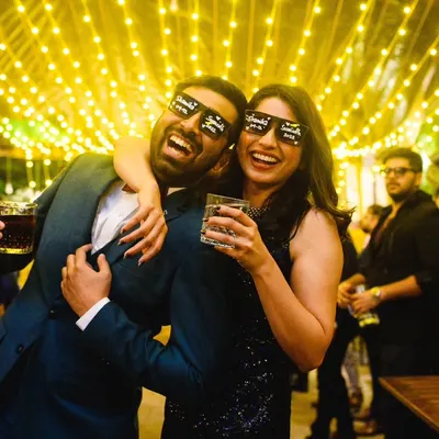 A totally mad cocktail party. Shamika and Sumedh, with their fun glasses and drinks in hand, were ready to party with their friends. The fairy lights and their energy made for some awesome photos.