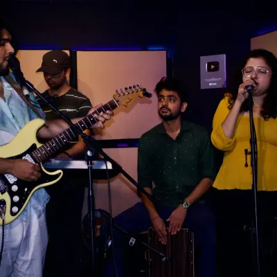 Collaboration is at the heart of our bootcamps. This is a snapshot of a jam session where students work together, combining guitar, vocals, and percussion to create music on the spot. It's a fantastic way to learn and connect with fellow musicians.