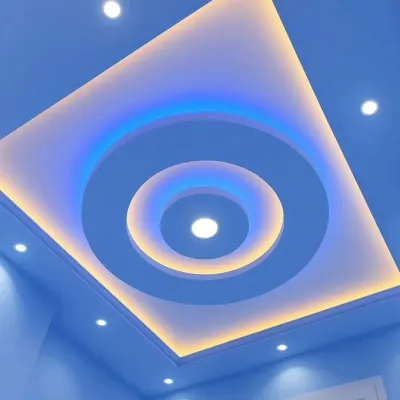 A stunning example of dual-color lighting. This circular ceiling design uses a combination of blue and yellow light to create a vibrant, futuristic effect.