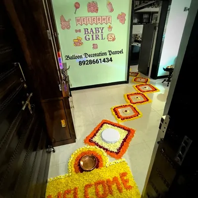 A traditional and auspicious welcome for a baby girl. I created this beautiful 'WELCOME' floral rangoli at the doorstep using marigold and other fresh flowers, leading into the decorated home.