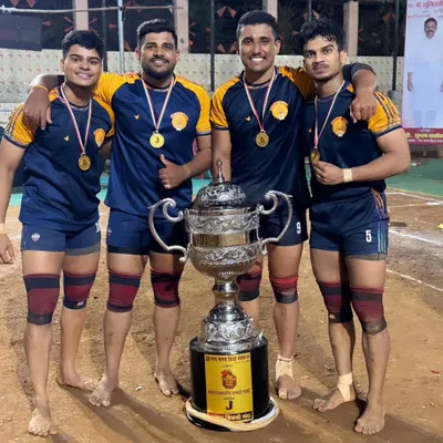 Our players proudly posing with their medals and the championship trophy. For us, senior players are more than coaches, they are big brothers.