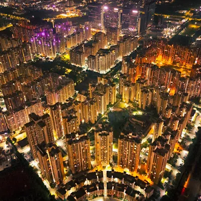 An aerial night view of Noida's cityscape, showing the glowing grid of residential towers. My high-resolution drone photography captures the vibrant energy of the city after dark, turning urban sprawl into a pattern of light.