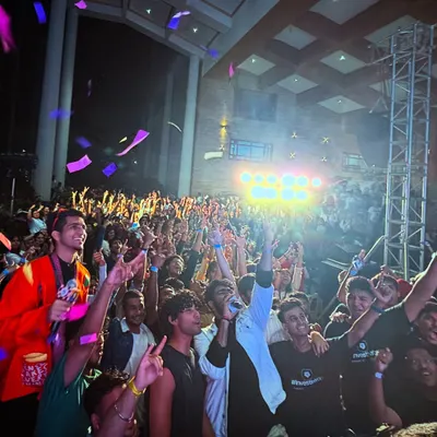 The moment the confetti drops during my set at the Under 25 Summit at Christ University. This is the peak energy I build towards, creating an explosive finale for the students.