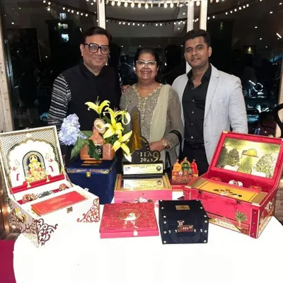 A proud moment for our team, showcasing our International Iconic Award for 2023. The trophy is displayed alongside a selection of our award-winning luxury invitation boxes.
