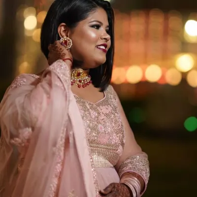 This is a candid shot from a wedding I attended. I did my own makeup with a classic smokey eye and a bold red lip. I believe you should always feel confident and beautiful, ready to stand out. 💕