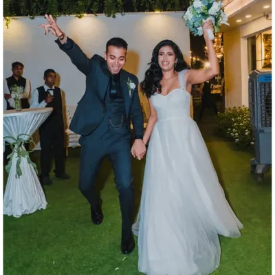 The grand entrance into the after-party! We capture the couple's high energy and excitement as they jump for joy, ready to celebrate with their loved ones.