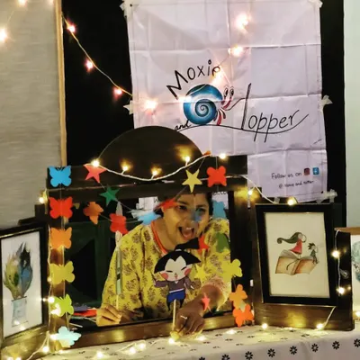 Peekaboo! Here I am using one of our handmade stick puppets to tell a story. These little characters are a huge hit with the kids and really help bring the narrative to life.