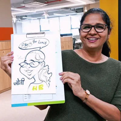 Bringing some artistic fun to the office. This HR professional loved her caricature with the inspiring "Sky is the Limit" message.