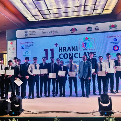 Our students stand proudly on stage with their certificates at the 11th HRANI Conclave at Le Meridien, New Delhi. This experience provided them with firsthand exposure to a high-profile event in the hospitality and tourism sector.