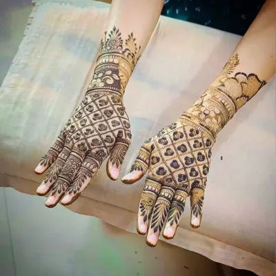 A classic back-hand design featuring a full-coverage jaali (net) pattern, accented with a beautiful floral cuff at the wrist.