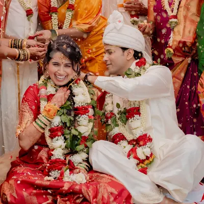 A candid moment of pure joy during A & N's Muhurtham. The laughter and showering of blessings from family create a memory filled with warmth and happiness.