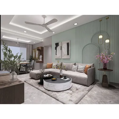 This living room design showcases a blend of modern comfort and subtle elegance. We used a soothing pastel green accent wall with decorative arches and contemporary furniture to create a space that is both stylish and welcoming for the family.