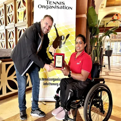 One of our star wheelchair tennis players receiving the women's doubles runner-up award at the TTF Cup. Her success on the international stage is an inspiration to our entire community.