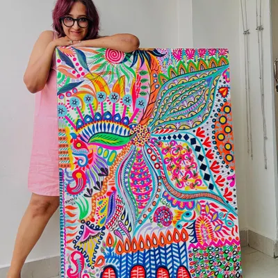 The artist and the art. This is me with my 3x4ft acrylic painting, 'Simplicity.' It's available for purchase and ready to bring its vibrant energy to a new home.