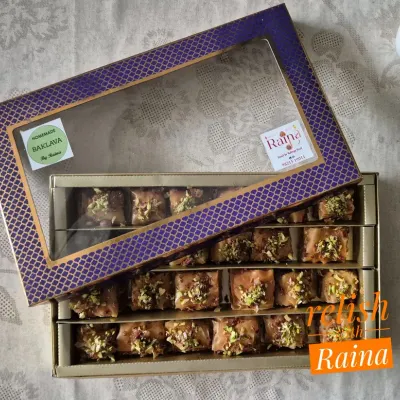 A beautiful gift box of my homemade Square Baklava. This rich Turkish pastry is made with layers of phyllo, filled with pistachios and almonds, and soaked in a jaggery-honey syrup.