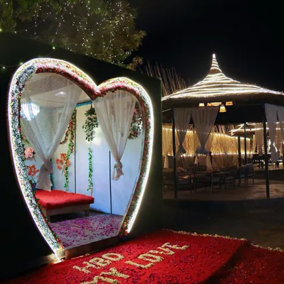 This is my signature heart-shaped cabana, set up for a special proposal. The flower petal path and glowing lights make for a truly magical entrance.