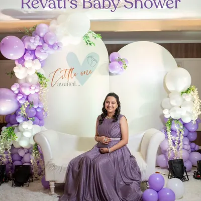 The beautiful mom-to-be at her baby shower. We designed this "Little One Awaited" backdrop with soft colours and balloons to create the perfect photo spot.