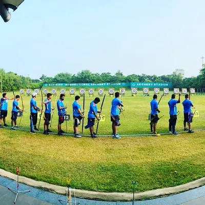 This is the kind of professional environment we prepare our archers for. A wide view of the shooting line at the KIIT International archery ground gives a sense of the scale of major university and national events.