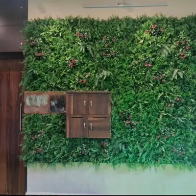 A completed artificial green wall installation for a bungalow porch. This premium, dense foliage wall creates a stunning maintenance-free entrance and integrates seamlessly with the home's architecture, including a custom cutout for the letterbox.