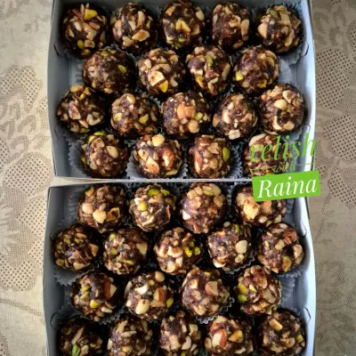 Two boxes of my popular sugar-free Dryfruit Laddoos, ready for delivery. Each laddoo is loaded with crunchy nuts like cashews and pistachios, held together by sweet dates.