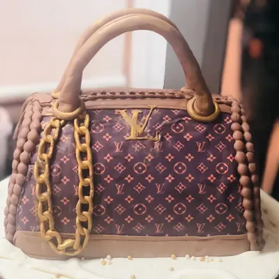 This 3D LV bag cake is a masterpiece of edible luxury. I meticulously recreated the iconic monogram pattern, gold chain, and bag structure, making it a showstopper for any fashion-forward celebration.