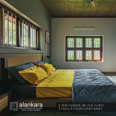 This custom bed features a headboard with a natural cane weave panel, set against a dark grey wall for a dramatic effect. The vibrant yellow and grey bedding adds a modern, cheerful touch.