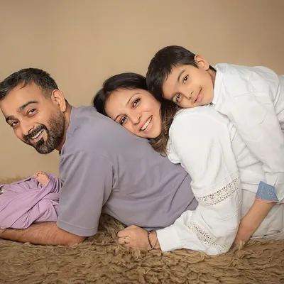 A pile of love! This is what family is all about. I gently pose everyone together to create a portrait that is full of warmth, smiles, and the joy of your complete family.