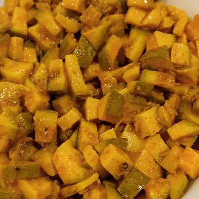 These are the small, bite-sized cubes of our classic Aam ka Achaar. They are perfect for mixing with rice or just having a small bite when you crave that tangy flavour.