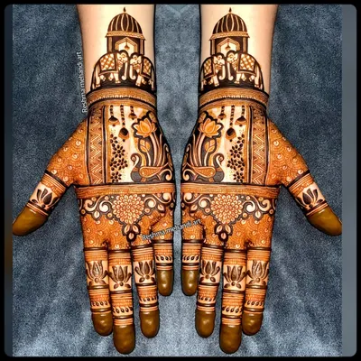 A perfect example of symmetrical bridal mehandi. Both hands feature identical designs with palace domes, elephants, peacocks, and lotus motifs for a balanced and royal look.