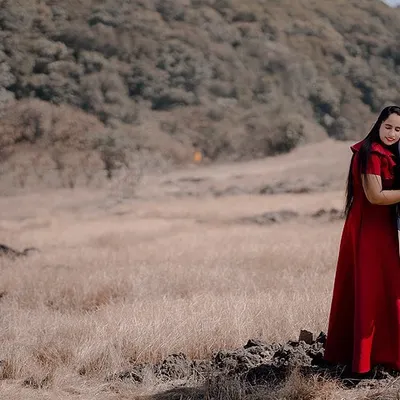 A quiet moment of togetherness for Karan and Simarpreet in a wide, open landscape. This photo emphasizes peace and intimacy, showing that love can be a calm and steady presence.
