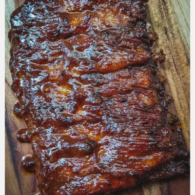 My Barbeque Pork Ribs are slow-grilled in a smoky, tangy homemade BBQ sauce until they are fall-off-the-bone tender. This is a full rack of juicy, flavour-packed ribs, perfect for sharing.