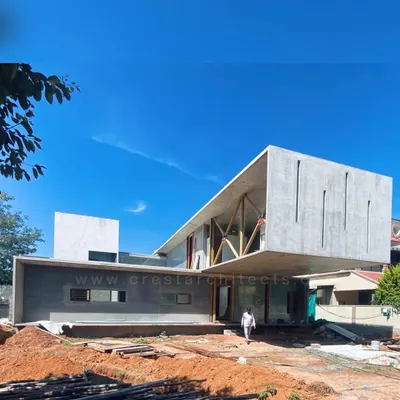 The Long House under construction, showcasing the impressive 23-foot cantilevered volume. This image reveals the raw structural ambition before the application of finishing materials.