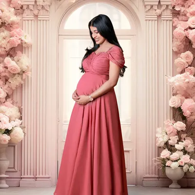 An example of our elaborate floral studio sets, featuring a grand doorway and arch covered in pink flowers.